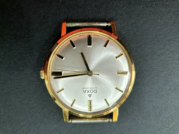 Doxa Synchron Vintage, carcasă aurie, cadran argintiu aur stare excelent